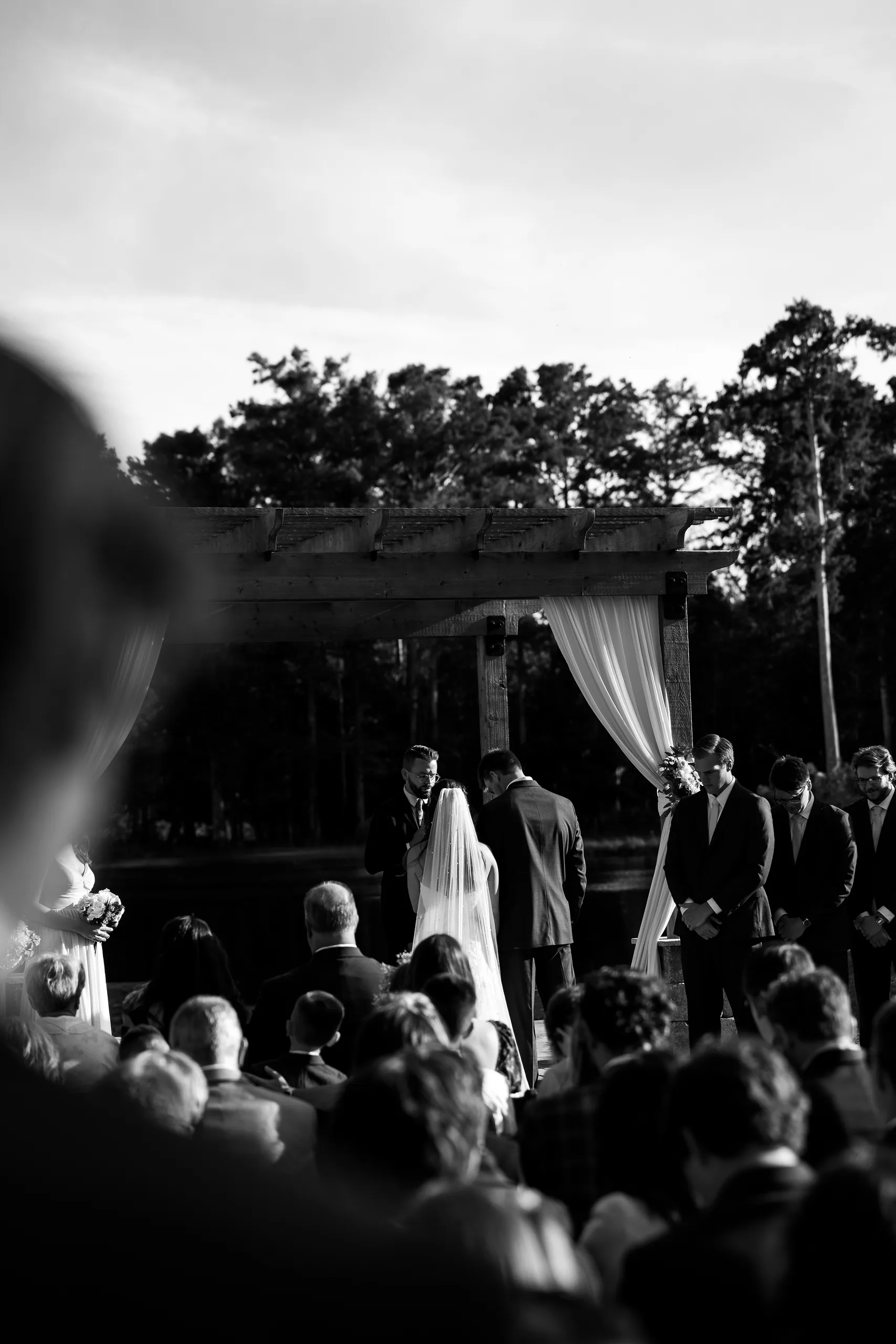 Outdoor ceremony vows under the draped pergola at Cypress Creek Farmhouse, Orlando FL
