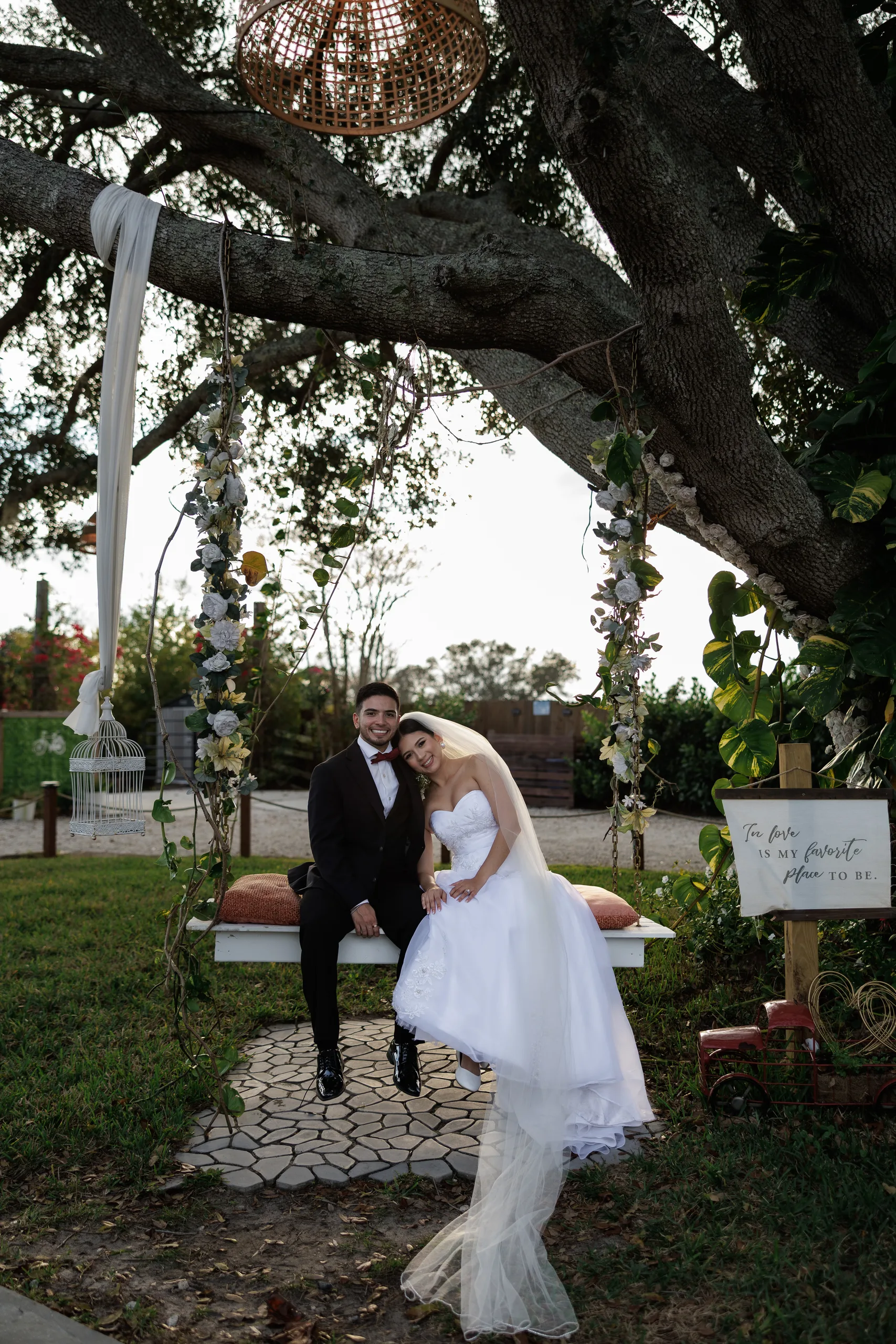 Newlyweds on the oak tree swing at The Hill House, Clermont FL