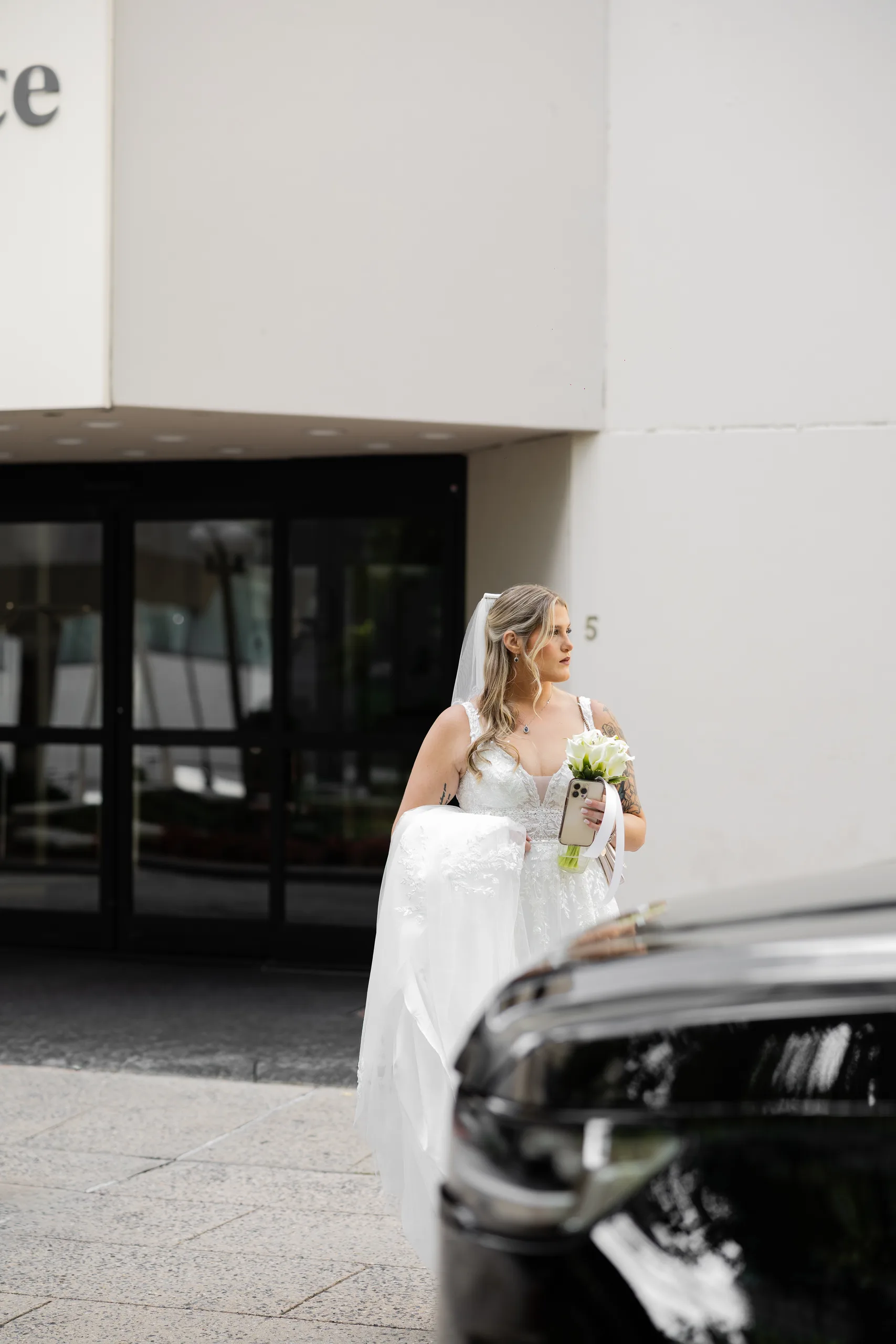 Bride arriving with her bouquet before the ceremony on her J House Greenwich wedding day