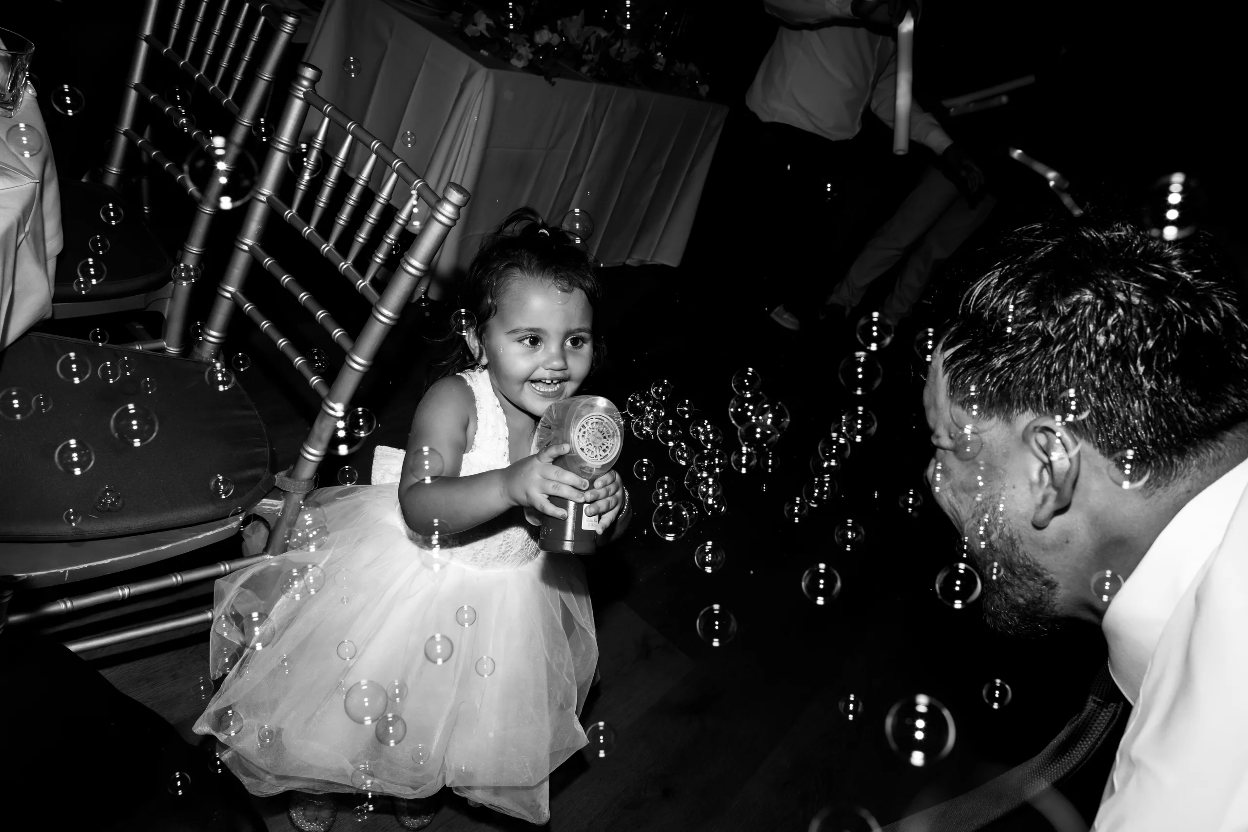 Flower girl blowing bubbles at The J House Greenwich reception, Greenwich CT