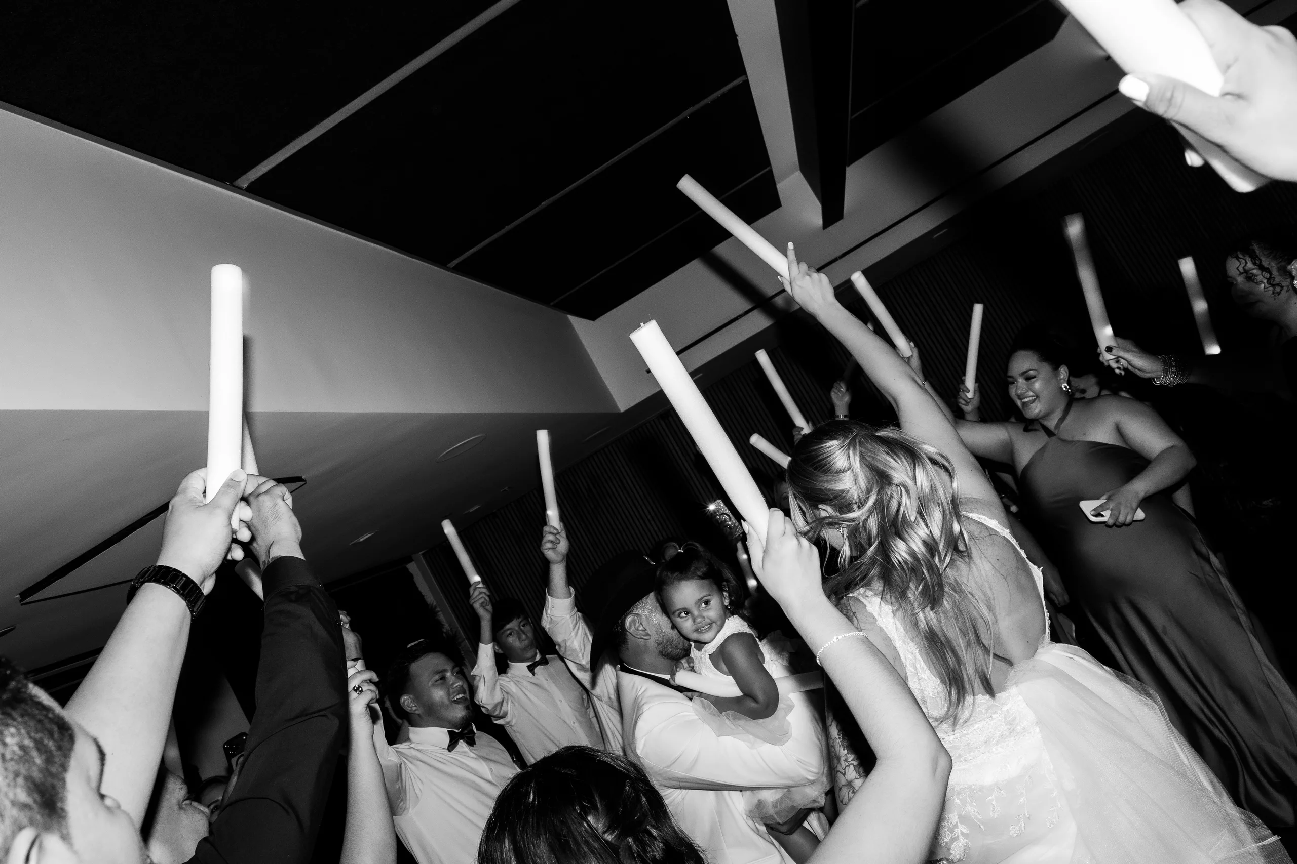 Guests raising glow sticks for the send-off at The J House Greenwich, Greenwich CT